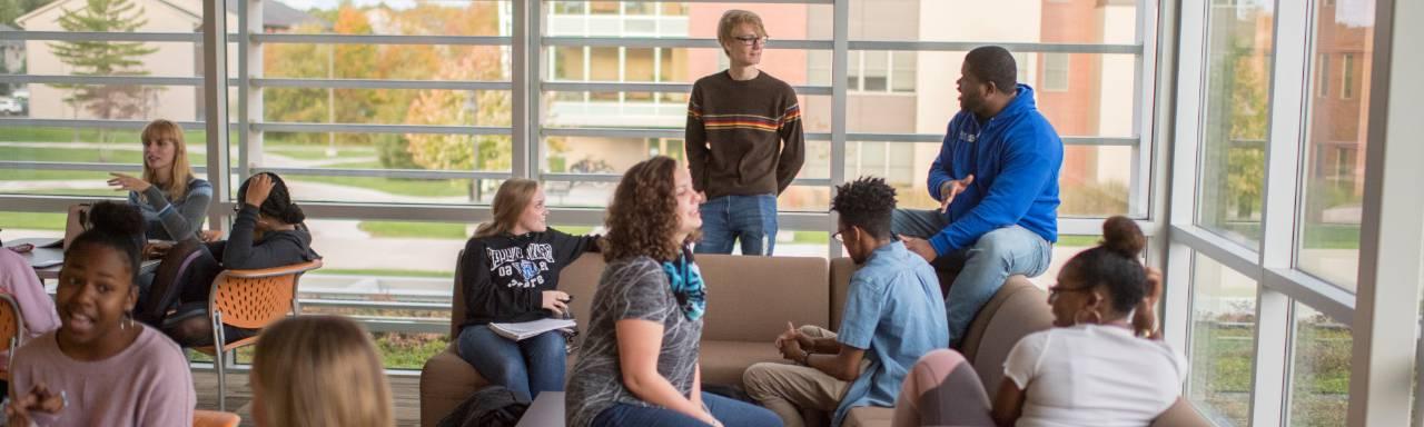 Students in a housing group lounge.